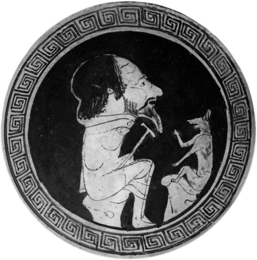 An ancient bowl is decorated by Coyote talking to a large man.